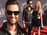 Adam Levine and Behati Prinsloo walk the red carpet for the first time at MTV Video Music Awards since tying the knot
