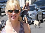 Anna Faris displays lean legs in denim shorts as she takes her beloved dog Bonzo to the vet