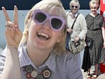 Loud and proud! Lena Dunham is typically eye-catching in funky pink sunglasses before glamming up in geometric dress at Venice Film Festival