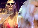 Keeping it classy: Paris Hilton used a champagne cooler to accept the ALS Ice Bucket Challenge at Amnesia Ibiza on Wedesnday