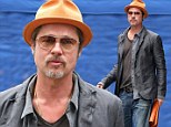 The honeymoon is over! Brad Pitt gets back to work in New York after brief romantic holiday with Angelina Jolie