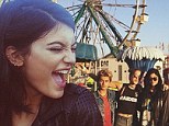 'Carnival vibes': Kylie Jenner stands out in her signature stylish get-up as she lets her hair down on a trip to the fair with pals