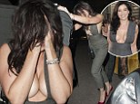 Daisy Lowe nearly spills out of her plunging jumpsuit as she leaves the GQ Men Of The Year Awards looking worse for wear
