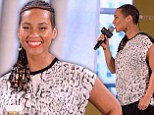 Blossoming: Alicia Keys showed just a hint of a baby bump as she attended the launch of Givenchy's new fragrance Dahlia Divin in New York City on Tuesday