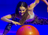 Fashion from the Athleta Spring 2015 collection is modeled in an acrobatic show during Fashion Week on Wednesday, Sept. 3, 2014 in New York. (AP Photo/Bebeto...