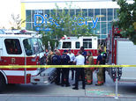 Firefighters confer out side the Nevada Disvory Museum in Reno, Nev., Wednesday Sept. 3, 2014. A minor explosion during a science experiment at the museum bu...