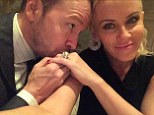 'Checking in from heaven': Jenny McCarthy and Donnie Wahlberg posed for their first newlywed selfie in a Twitter snap posted Tuesday