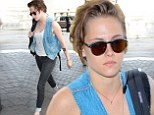 Kristen Stewart looks decidedly downcast as she arrives at LAX following reports of ex-boyfriend Robert Pattinson's hot new romance with singer FKA Twigs