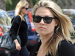Pregnant Ali Larter shows off baby bump as she steps out in athletic attire