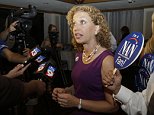 Democratic National Committee Chairwoman and congresswoman Debbie Wasserman Schultz  speaks to the news media at a gathering for supporters of Democratic gubernatorial candidate Nan Rich, Tuesday, Aug. 26, 2014, in Weston, Fla.  Rich later conceded defeat to her opponent Charlie Crist in the primary election for the democratic nomination for Florida Governor. (AP Photo/Lynne Sladky)