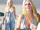 Pulling a Kim Kardashian! Gwyneth Paltrow shows off her decolletage in revealing gray jumpsuit with plunging neckline