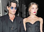 Best-dressed in black: Johnny Depp and his fiancée Amber Heard were a stunning pair in elegant black ensembles at Tuesday's GQ Men Of The Year Awards in London
