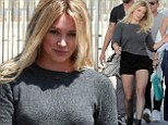 Hilary Duff gets frisky in fishnets and black shorts while filming her new music video... and husband Mike Comrie pays a visit too