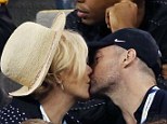 Kissing couple: Hugh Jackman and his wife Deborra-Lee Furness shared a kiss on Thursday at the US Open tennis tournament in New York City