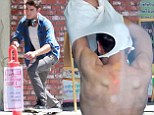 Quick change! Zac Efron strips down after a skateboarding session on set