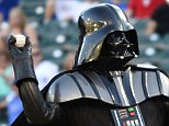 epaselect epa04387014 A man dressed as Star Wars character Darth Vader throws out the first pitch before the Texas Rangers game against the Seattle Mariners at Globe Life Park in Arlington, Texas, USA, 05 September 2014.  EPA/LARRY W. SMITH