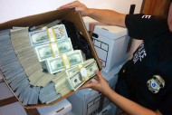 Federal authorities have seized roughly $65 million in a crackdown on suspected drug money laundering in the fashion district of Los Angeles on Sept. 10