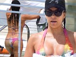 Eva Longoria displays pert posterior in cheeky bikini while enjoying a romantic dip in the pool with beau Jose Antonio Baston
