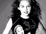 That's just creepy! Miley Cyrus posted this 'flashback' picture of her younger self wearing one of her more recent tour merchandise items on Sunday