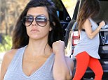 Three more months! Pregnant Kourtney Kardashian displays her growing bump in a grey racer-back top at LA gas station