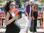 Any day now! Mila Kunis can't help but show off huge baby bump for lunch with Ashton Kutcher... a day after yet another yoga class