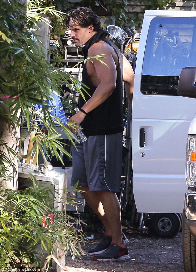 Hard at work: Meanwhile, Joe showed off his extremely buff arms on the set of Magic Mike XXL in Savannah, Georgia