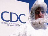 21 Jan 2002, Atlanta, Georgia, USA --- May 1995: Lynn Meyers of the Centers for Disease Control and Prevention models a protective suit used during the study of ebola virus. --- Photo by Shepard Sherbell/Corbis SABA --- Image by © Shepard Sherbell/Corbis