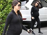 Kourtney Kardashian wears a skin tight hoody which appears super snug around her expanding baby bump. October 20, 2014 X17online.com