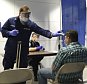 U.S. Coast Guard Health Technician Nathan Wallenmeyer (L) and Customs Border Protection (CBP) Supervisor Sam Ko conduct prescreening measures on a passenger arriving from Sierra Leone at OíHare International Airport's Terminal 5 in Chicago, in this handout picture taken October 16, 2014.  Travelers entering the United States whose trips originated in Ebola-stricken Liberia, Sierra Leone or Guinea must fly into one of five airports that have enhanced screening in place, the U.S. Department of Homeland Security said on Tuesday.  Picture taken October 16, 2014.  REUTERS/U.S. Customs Border Protection/Melissa Maraj/Handout via Reuters   (UNITED STATES - Tags: HEALTH TRAVEL) THIS IMAGE HAS BEEN SUPPLIED BY A THIRD PARTY. IT IS DISTRIBUTED, EXACTLY AS RECEIVED BY REUTERS, AS A SERVICE TO CLIENTS. FOR EDITORIAL USE ONLY. NOT FOR SALE FOR MARKETING OR ADVERTISING CAMPAIGNS