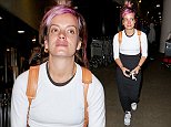 Lily Allen looks cute with purple hair while sporting a long black skirt at LAX. October 22, 2014 X17online.com