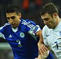 LONDON, ENGLAND - OCTOBER 09: James Milner of England and Manuel Battistini of San Marino during the EURO 2016 Group E Qualifying match between England and San Marino at Wembley Stadium on October 9, 2014 in London, England.  (Photo by Shaun Botterill/Getty Images)