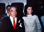 Aristotle Onassis stands with his new wife Jacqueline Kennedy after their marriage in the tiny chapel on the Island of Scorpios in Greece on Oct. 20, 1968.  Jackie and Aristotle are seen aboard the yacht  "Christina."  (AP Photo)