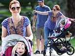 EXCLUSIVE: Alyson Hannigan looks to enjoying life after 9 years starring on 'How I Met Your Mother'. With a smile on her face she was spotted pushing her adorable two year old, Keeva, who had a lollipop in her hand and also a big smile on her face. They were followed by dad Alexis Denisof and oldest daughter Satyana. Wearing her hair back and sporting oversized sunglasses and a blue patterned native indian-inspired top, the 40 year old actress was pictured in her Santa Monica neighbourhood looking at Halloween decorations and pointing them out to daughter Keeva.\n\nPictured: Alyson Hannigan, Keeva Denisof and Alexis Denisof\nRef: SPL874321  251014   EXCLUSIVE\nPicture by: Splash News\n\nSplash News and Pictures\nLos Angeles:\t310-821-2666\nNew York:\t212-619-2666\nLondon:\t870-934-2666\nphotodesk@splashnews.com\n