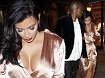 EXCLUSIVE: Kim Kardashian West and Kanye West look stunning as they leave the cinema at The Grove in Los Angeles, California. The happy couple were dressed to the nines, having gone to the cinema straight from a wedding reception. Kim wore a long-sleeved, deep-cut, pink satin gown, slashed to the thigh, while Kanye opted for leather trousers. The duo were reported to have seen the horror movie 'Ouija'. They caused quite a stir at the popular West Hollywood mall, with fans clamoring to get a glimpse of them as they left the theatre.\n\nPictured: Kim Kardashian and Kanye West\nRef: SPL874808  251014   EXCLUSIVE\nPicture by: Splash News\n\nSplash News and Pictures\nLos Angeles:\t310-821-2666\nNew York:\t212-619-2666\nLondon:\t870-934-2666\nphotodesk@splashnews.com\n