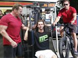 Please contact X17 before any use of these exclusive photos - x17@x17agency.com   Arnold and Katherine Schwarzenegger do a pre-Thanksgiving workout riding their bikes with a friend in Santa Monica before tomorrow's feast. November 26, 2014 X17online.com EXCL