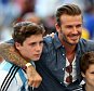Former England international David Beckham and sons Brooklyn Beckham (L), Cruz Beckham (2nd R) and Romeo Beckham (R) prior to the 2014 FIFA World Cup Brazil Final match between Germany and Argentina at Maracana on July 13, 2014 in Rio de Janeiro, Brazil.  (Photo by Michael Steele/Getty Images)