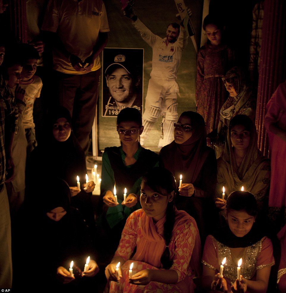 Pakistani cricket fans light candles to pay tribute to Australian cricketer in Karachi, Pakistan
