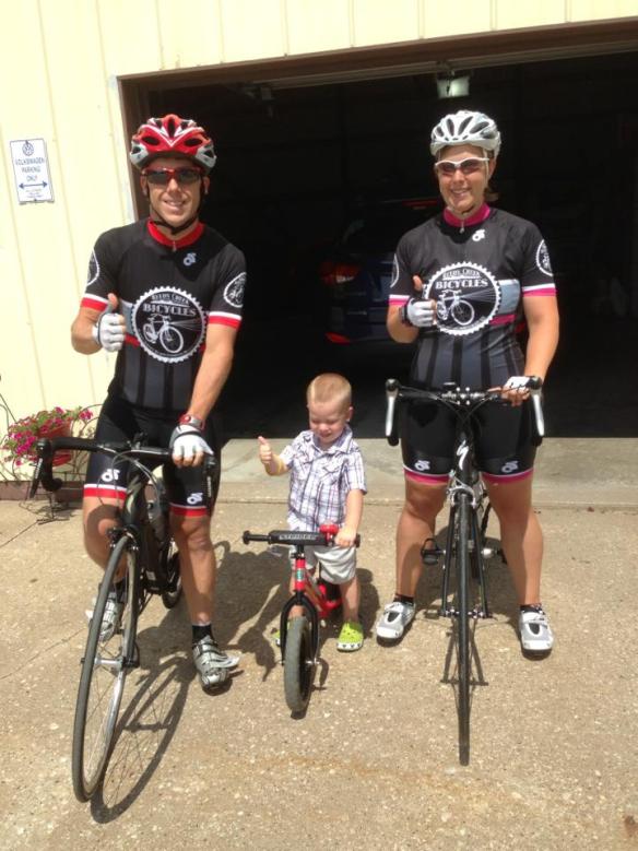 Donald and Kelly Sorah on bikes with son