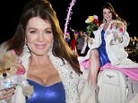 PALM SPRINGS, CA - DECEMBER 06:  TV personality Lisa Vanderpump serves as Grand Marshall of Palm Springs Festival Of Lights Parade wearing a diamond encrusted Marc Bouwer faux fur on December 6, 2014 in Palm Springs, California.  (Photo by Chelsea Lauren/WireImage)