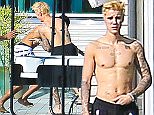 10.DEC.2014 - BEVERLY HILLS
***EXCLUSIVE ALLROUND PICTURES***
BLONDE POP STAR JUSTIN BIEBER ENJOYS HIS NEW POOL WITH SOME FRIENDS MINUS NEW GIRLFRIEND HAILEY BALDWIN IN BEVERLY HILLS, JUSTIN RELAXED WITH HIS FRIENDS IN THE POOL WHILE GRILLING THEIR LUNCH ON THE BBQ AT HIS NEW ULTRA MODERN BEVERLY HILLS MANSION DESIGNED BY ED NILES, DEEMED THE BEVERLY HILLS GLASS HOUSE, THE 6 BEDROOM 7 BATHROOM BATCHELOR PAD IS COSTING THE 'BEAUTY AND THE BEAT' SINGER A WHOPPING  $59,000 A MONTH.
BYLINE MUST READ : XPOSUREPHOTOS.COM
***AVAILABLE FOR UK AND GERMANY ONLY***
***UK CLIENTS - PICTURES CONTAINING CHILDREN PLEASE PIXELATE FACE PRIOR TO PUBLICATION ***
*UK CLIENTS MUST CALL PRIOR TO TV OR ONLINE USAGE PLEASE TELEPHONE 0208 344 2007*