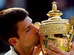 Novak Djokovic of Serbia kisses the Gentlemen's Singles Trophy following his victory in the Gentlemen's Singles Final match against Roger Federer of Switzerland on day thirteen of the Wimbledon Lawn Tennis Championships at the All England Lawn Tennis and Croquet Club in London, England.  

LONDON, ENGLAND - JULY 06:  
(Photo by Al Bello/Getty Images)