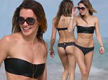 'Arrow' actress Katie Cassidy takes a walk on the beach in a black thong bikini in Miami beach, FL. Katie, 28, wore a black bandeau top with black and white polka dot thong bottoms. Katie wore a lot of jewerly for her beach outing, including a gold body chain.\n\nPictured: Katie Cassidy\nRef: SPL916107  201214  \nPicture by: Pichichi / Splash News\n\nSplash News and Pictures\nLos Angeles: 310-821-2666\nNew York: 212-619-2666\nLondon: 870-934-2666\nphotodesk@splashnews.com\n