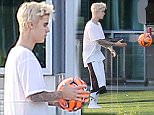 19.DEC.2014 - BEVERLY HILLS - USA\n** EXCLUSIVE ALL ROUND PICTURES **\n***AVAILABLE FOR UK AND GERMANY ONLY***\nBLEACHED BLONDE CANADIAN POPSTAR JUSTIN BIEBER HAS A KICK ABOUT WHILE HAVING A CONVERSATION WITH HIS MANAGER SCOOTER BRAUN AT HIS NEW ULTRA MODERN MANSION IN BEVERLY HILLS \nBYLINE MUST READ : XPOSUREPHOTOS.COM\n***UK CLIENTS - PICTURES CONTAINING CHILDREN PLEASE PIXELATE FACE PRIOR TO PUBLICATION ***\n*UK CLIENTS MUST CALL PRIOR TO TV OR ONLINE USAGE PLEASE TELEPHONE 0208 344 2007*