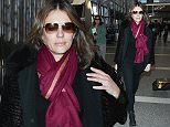 January 16, 2015: Elizabeth Hurley greets makes her way through LAX airport in Los Angeles, CA.  \nMandatory Credit: INFphoto.com Ref.: inf-00
