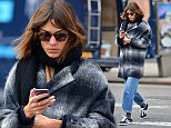 131634, EXCLUSIVE: Alexa Chung appears very absorbed in her cellphone as she is spotted in Soho. New York, New York - Wednesday January 21, 2015. Photograph:    PacificCoastNews. Los Angeles Office: +1 310.822.0419 sales@pacificcoastnews.com FEE MUST BE AGREED PRIOR TO USAGE