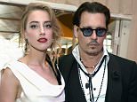 LOS ANGELES, CA - JANUARY 10:  Actors Amber Heard (L) and Johnny Depp attend the Art of Elysium and Samsung Galaxy present Marina Abramovic's HEAVEN at Hangar 8 on January 10, 2015 in Los Angeles, California.  (Photo by Jason Kempin/Getty Images  for Art of Elysium)