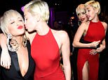 LOS ANGELES, CA - FEBRUARY 07:  Rita Ora and Miley Cyrus attend the Pre-GRAMMY Gala And Salute To Industry Icons Honoring Martin Bandier at The Beverly Hilton on February 7, 2015 in Los Angeles, California.  (Photo by Kevin Mazur/WireImage)