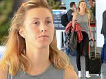 Please contact X17 before any use of these exclusive photos - x17@x17agency.com   Whitney Port traveling to New York wearing no make up and a tank top at LAX February 9, 2015 X17online.com