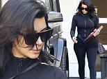 Kim Kardashian shows signs of greying hair when leaving the dermatologist's office in Beverly Hills. February 17, 2015 X17online.com