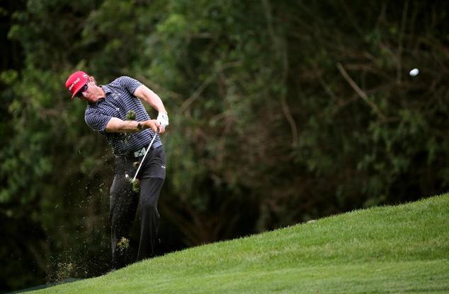 Ricky Barnes hits a shot on the 11th hole during the first round of the Valspar Championship, at Innisbrook Resort Copperhead Course in Palm Harbor, Florida,...